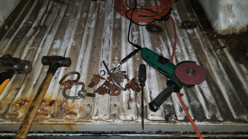 I cut the tops off of them and then ground what was left of the top down enough where I was able to smash them out with a hammer.
